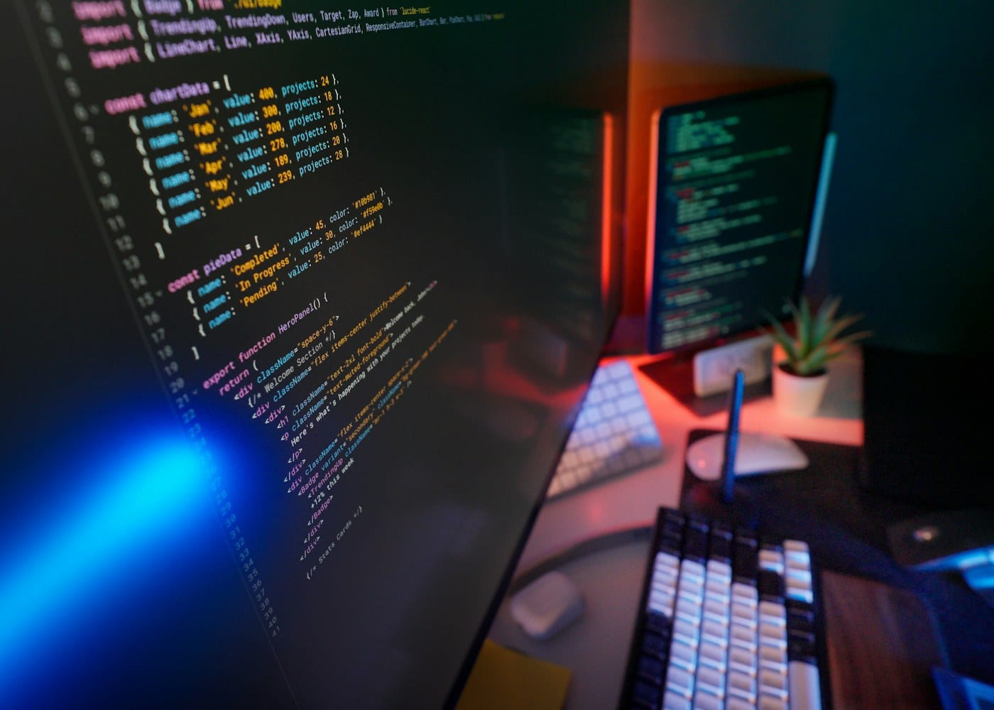Backend code across multiple monitors in a dark workspace