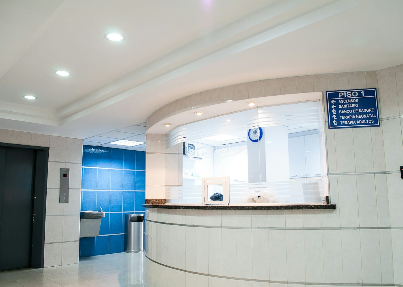 Hospital corridor with staff at a nurses' station